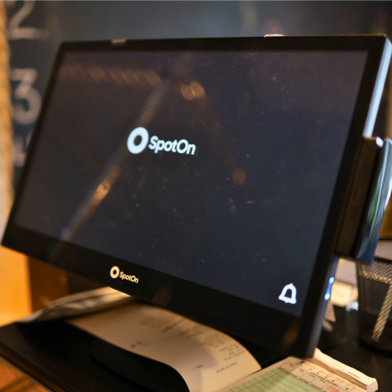 A SpotOn floating screen  on a counter top.